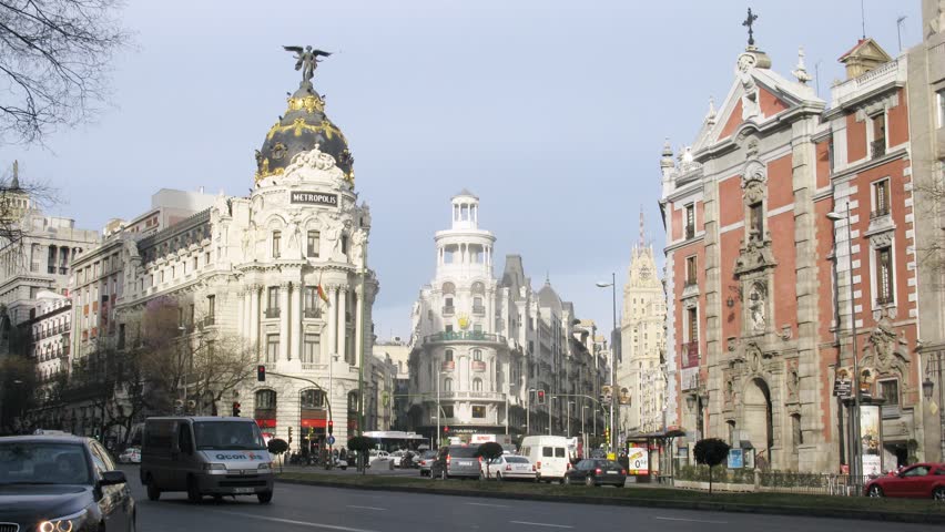 MADRID - MAR 8: (Timelapse View) Stream of cars goes near Metropolis hotel, on Mar 8, 2012 in Madrid, Spain. Construction of Metropolis Hotel required to destroy seven houses