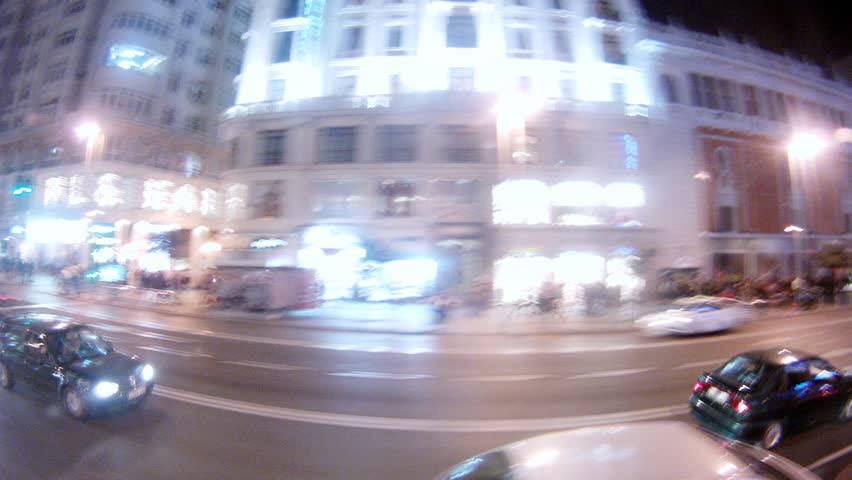 MADRID - MAR 10: (Timelapse View) Bus go on night city, on Mar 10, 2012 in Madrid, Spain