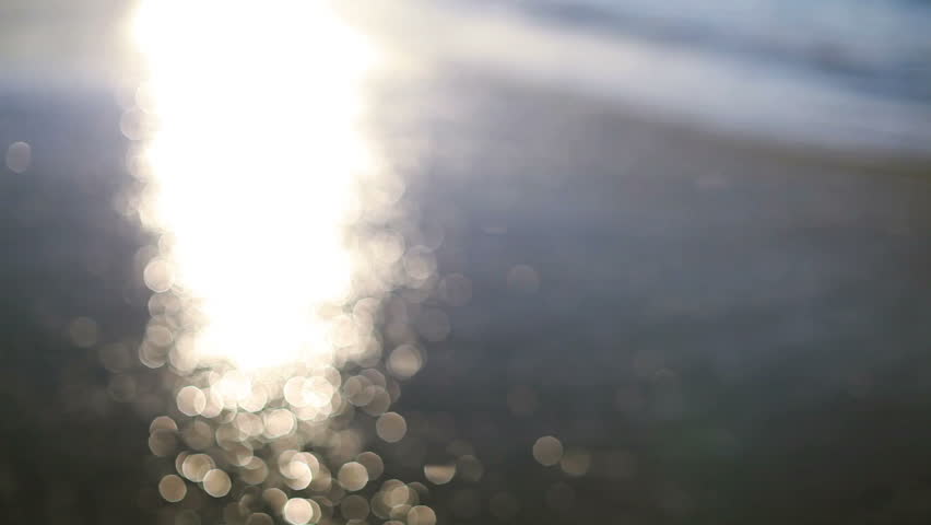 Sun glistening of the sand on the beach
