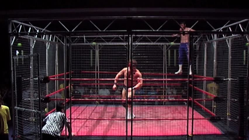 PORTSMOUTH - AUGUST 6: Cage Wrestling - Missile Dropkick during VPW Wrestling Show on August 6, 2009 in Portsmouth, England.