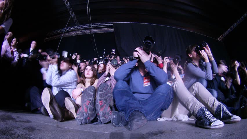 MOSCOW - APR 8: (Timelapse View) Many photographers photograph fashion show sitting on floor on VOLVO - Week of fashion in Moscow in Gostini dvor, on April 8, 2012 in Moscow, Russia