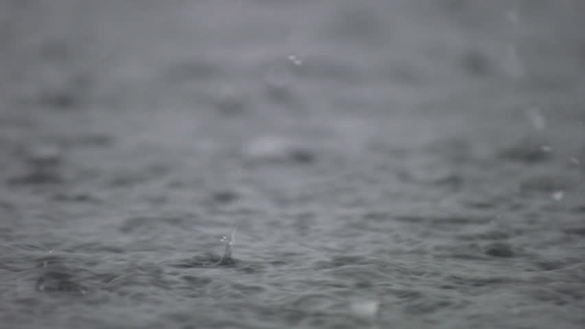 A closeup shot of heavy rain on water. Good sound!