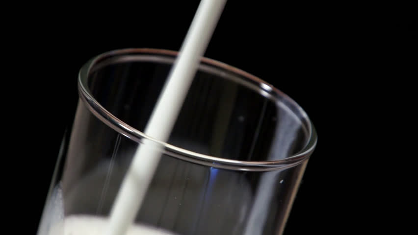 Glass filling with milk 