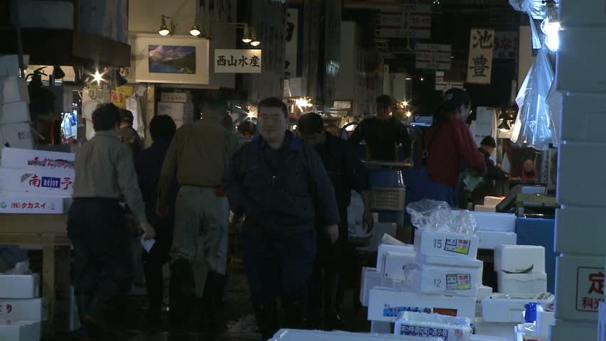 TOKYO, JAPAN - CIRCA 2008: carts pass in isle of wholesale fish market at Tsukiji market