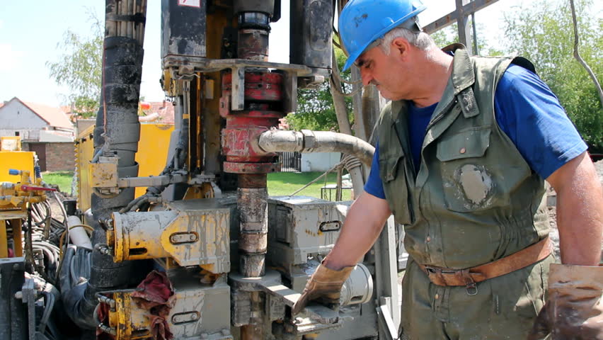 Oil worker drilling for oil on rig. HD1080p.