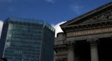 Stock Exchange, London - time lapse footage of the old and new London Stock Exchange buildings with storm clouds and sunshine creating contrasts and reflections on the current economic climate.
