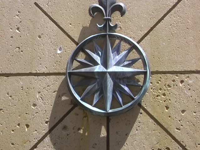 Water Running Down An Statue With An Emblem