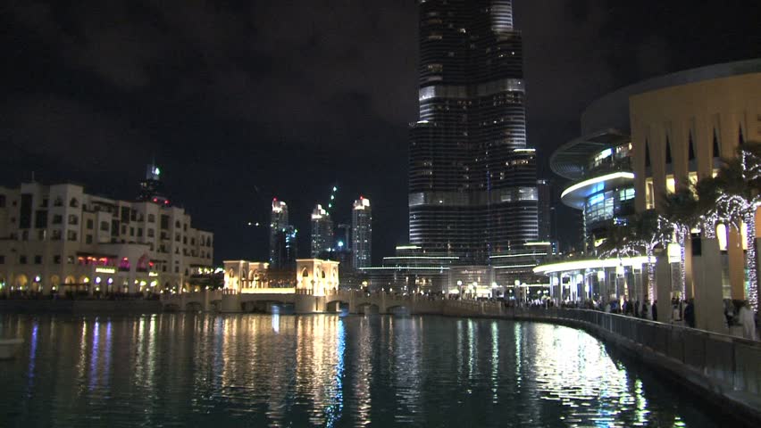 Dubai - Circa 2012: The Burj Khalifa in 2012: Looking up at the Burj khalifa, the highest skyscraper in the world, with The Dubai Fountain in Dubai, United Arab Emirates.