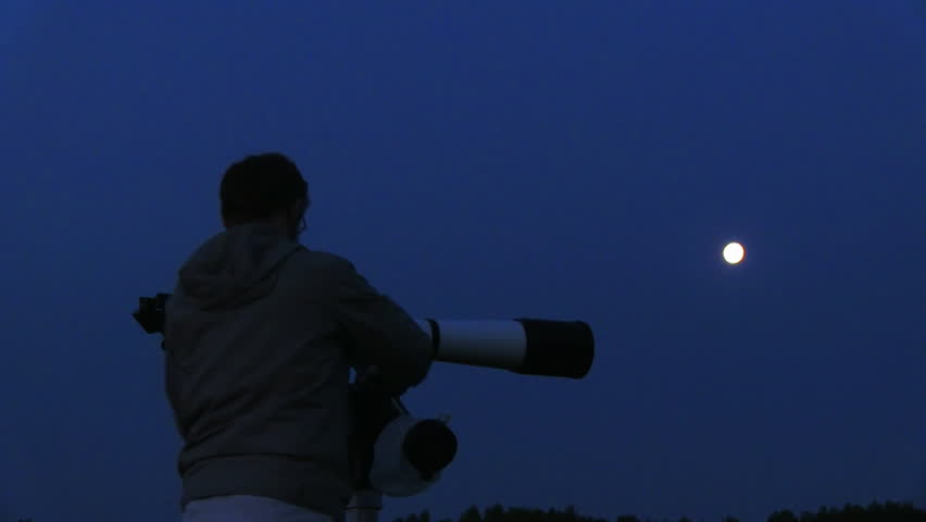 silhouette of telescope and astronomer