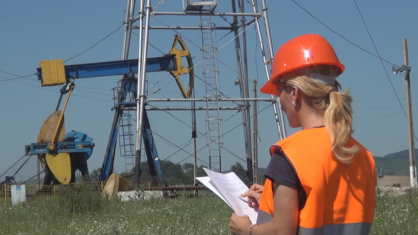 Fossil Fuel Energy, Female Engineer Working Near Oil Pump