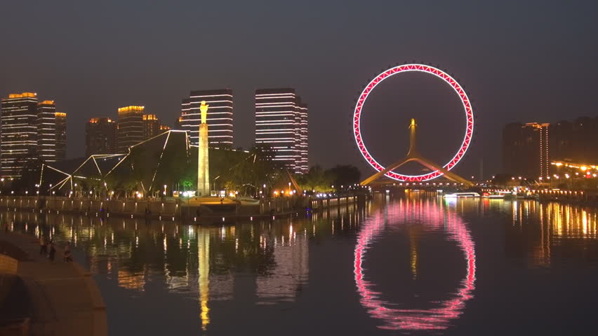 Timelapse of Tianjin Eye and Monument of Diversion Project from Luanhe to Tianjin by night, Tianjin, China