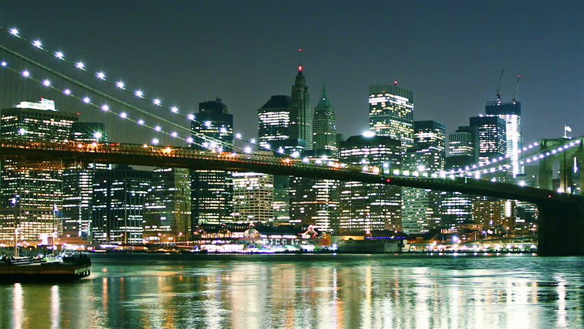 Manhattan skyline and Brooklyn bridge at night. Time lapse and loopable. High quality footage - original size 4k (4096x2304)