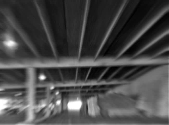 Car through tunnel. [with sound]