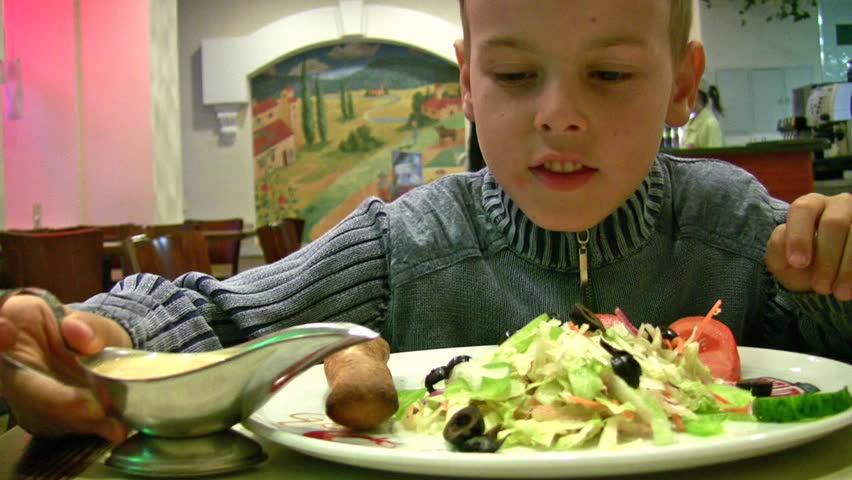 boy with sauce, bread, salad 
