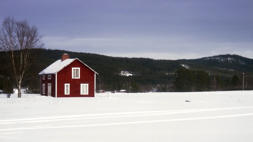 A red house in a winter landscape