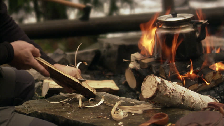 A man making a camp fire