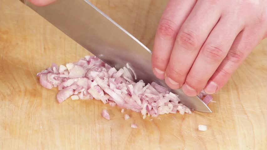 Shallots being finely chopped