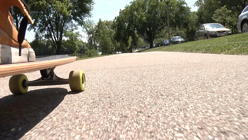 Man Riding on Skateboard.