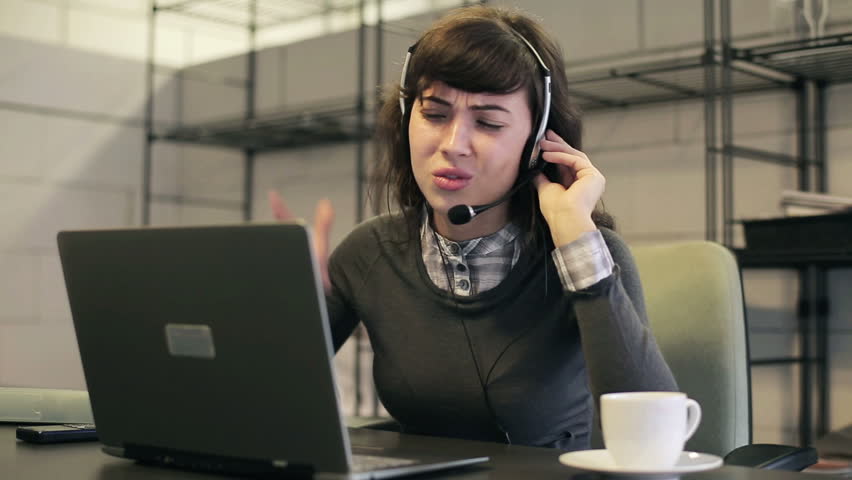 Angry female helpdesk consultant in the office
