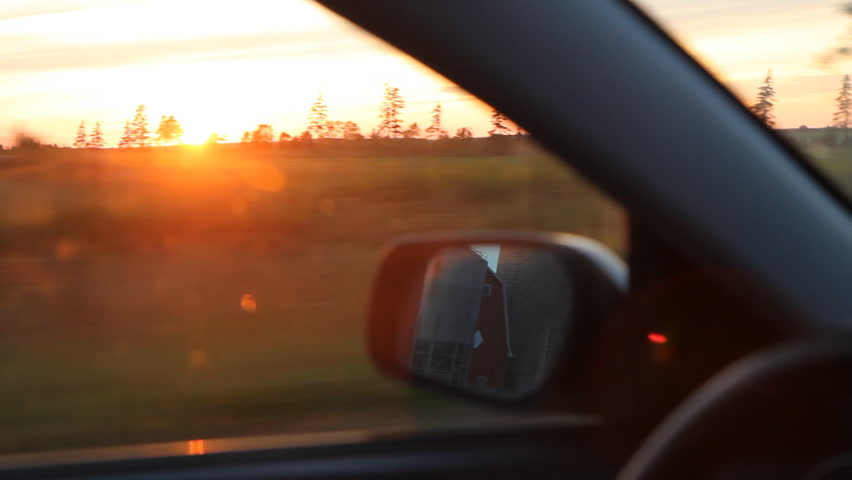 Sunset drive.
Driving in the country, with sun going down. Prince Edward Island, Canada.
