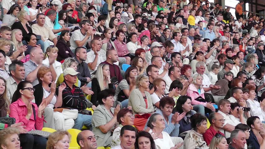 SUMY - JUNE 28: Crowd cheering on the city stadium celebrating the Day of the Constitution of Ukraine on June 28, 2012 in Sumy, Ukraine 