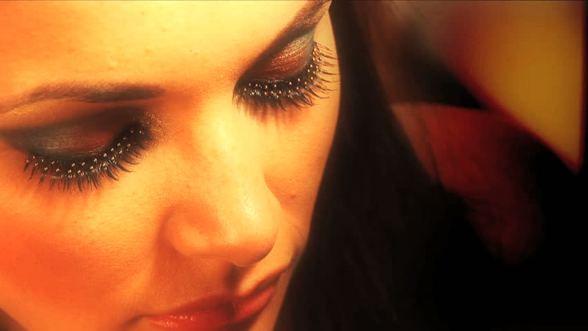 Close up image of beautiful eyes made up with rhinestones