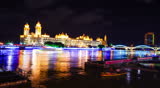 HD1080p: Buildings and pleasure boat by Minjiang River at night, Zhongzhou island, Fuzhou, China. Timelapse.