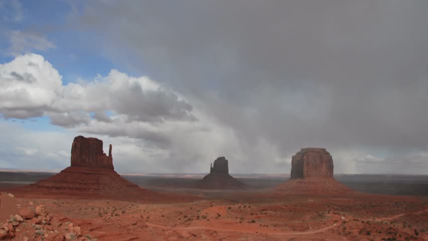 Time lapse clouds cross Monument Valley National Monument in Utah.