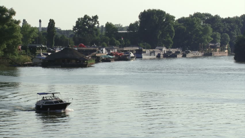 Belgrade, Danube river, restaurants and boats. Boat in foreground
