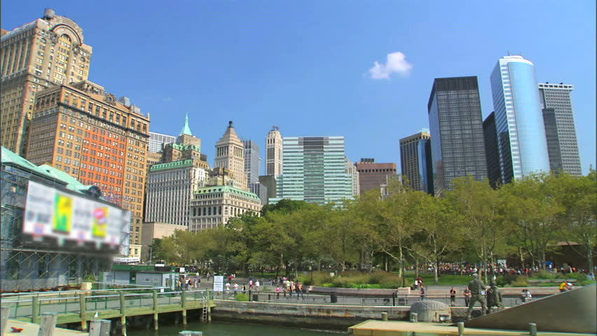 A wide shot of the skyline in Battery Park in Manhattan as seen from the Hudson river