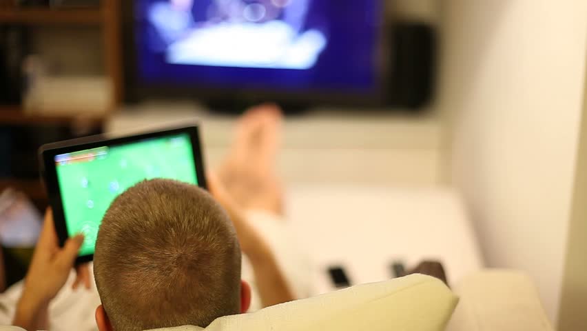 A boy on sofa with tablet