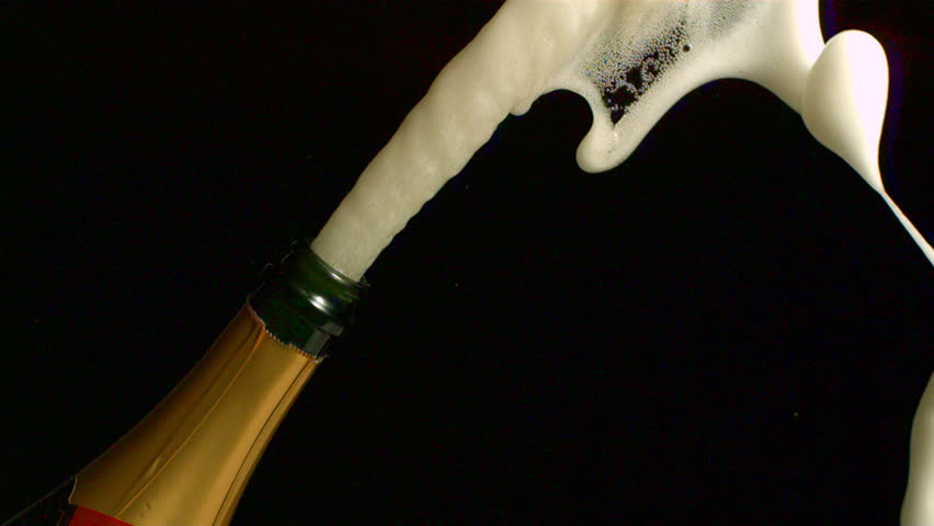 Champagne is being poured in a glass