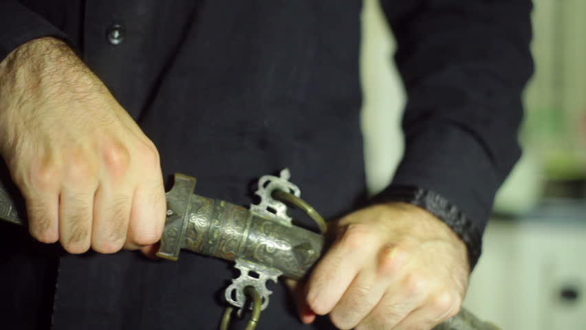 Pulling out a scary knife