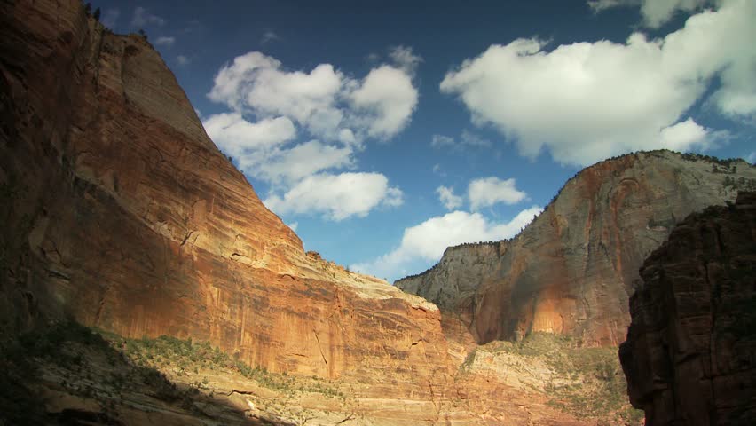 Scenic cliff face and blue sky with clouds at Zion National Park 