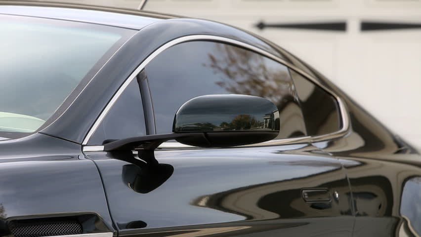 Man getting into car on drivers side