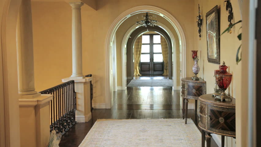Hallway with wood floors in an expensive home