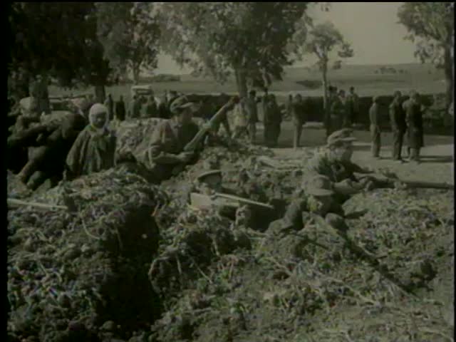 Blockade of french troops in Tunisia circa 1958. Tunisian soldiers aim guns in trenches - MGM PICTURES, UNIVERSAL-INTERNATIONAL NEWSREEL, USA, filmed in 1958