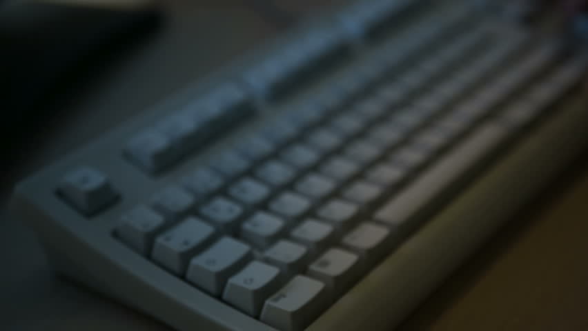 hacker close up typing on keyboard with sound