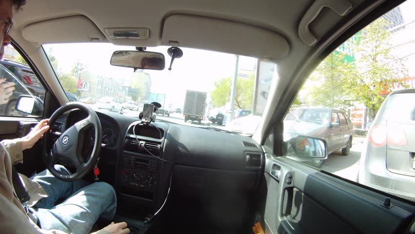 MOSCOW - MAY 16: (Timelapse View) Man goes in car on Kutuzovsky prospectus, on May 16, 2012 in Moscow, Russia