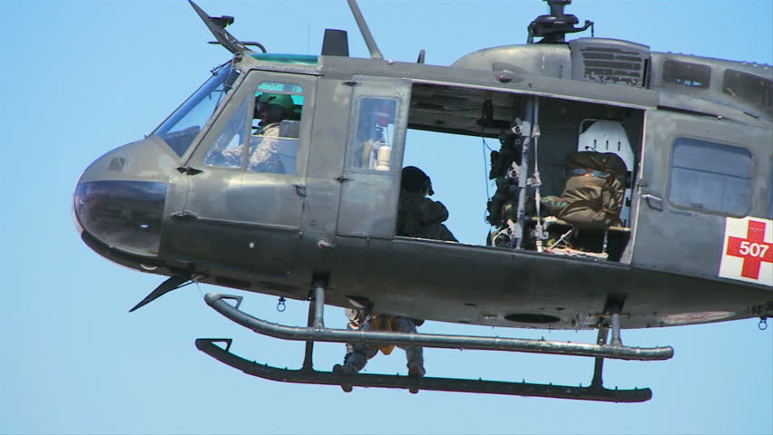 QUONSET, RHODE ISLAND - CIRCA JUNE 2012: Close-up Huey Helicopter hovering from side - 1