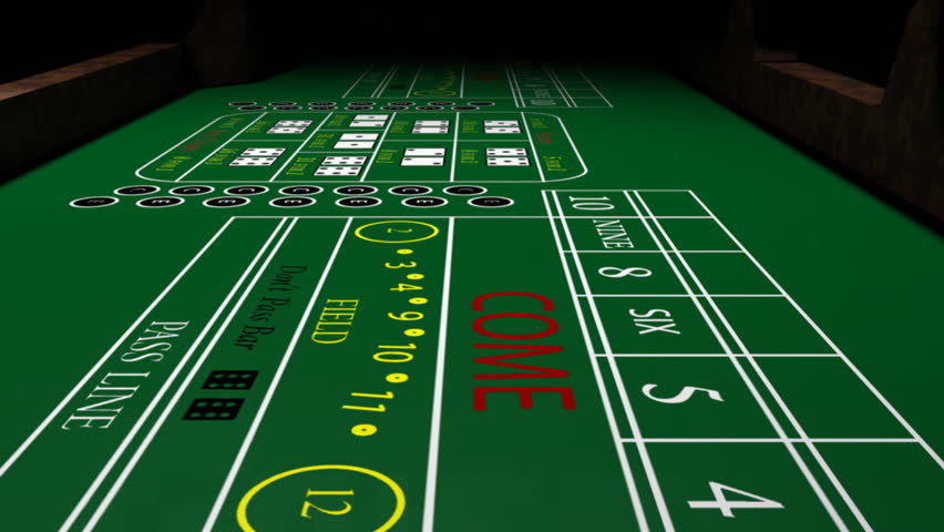Rolling the dice on a craps table.