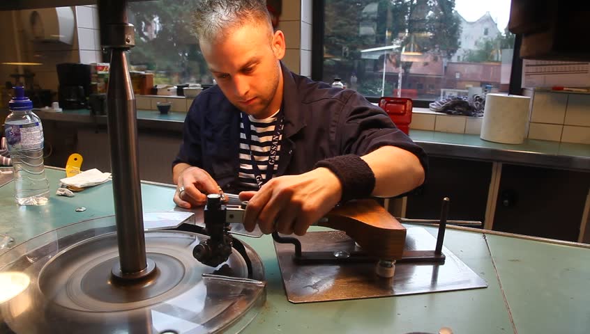 AMSTERDAM, THE NETHERLANDS - JULY 15: Diamond polisher creates a diamond with 121 facets at the Gassan Diamond factory in Amsterdam, The Netherlands, July 15, 2012