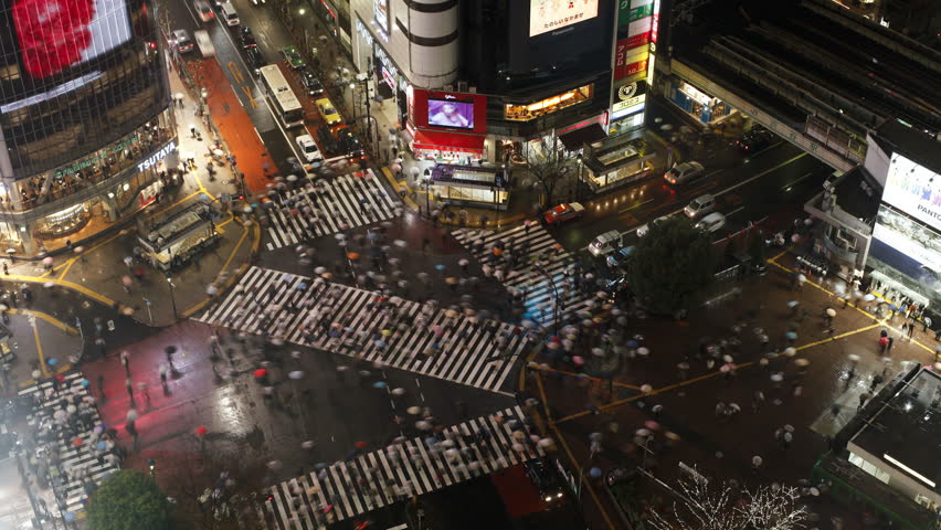 TOKYO, JAPAN - CIRCA MAY 2011: - crowds of people crossing the famous crosswalks at the centre of Shibuya's fashionable shopping and entertainment district