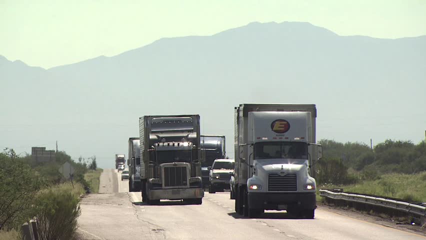 ARIZONA - CIRCA 2010: Cyclists In A Road Race As They Climb A Hill 