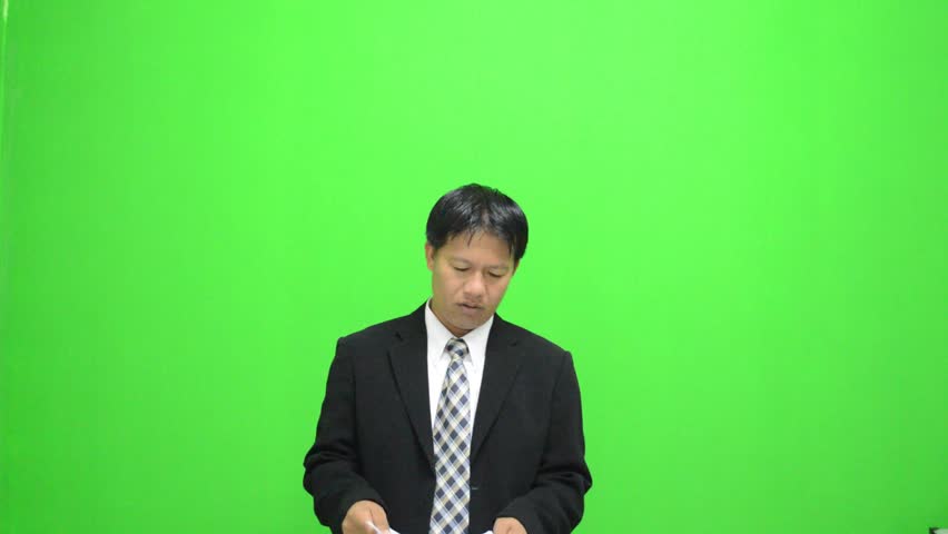 Chroma-key footage of businessman Inspection reports 