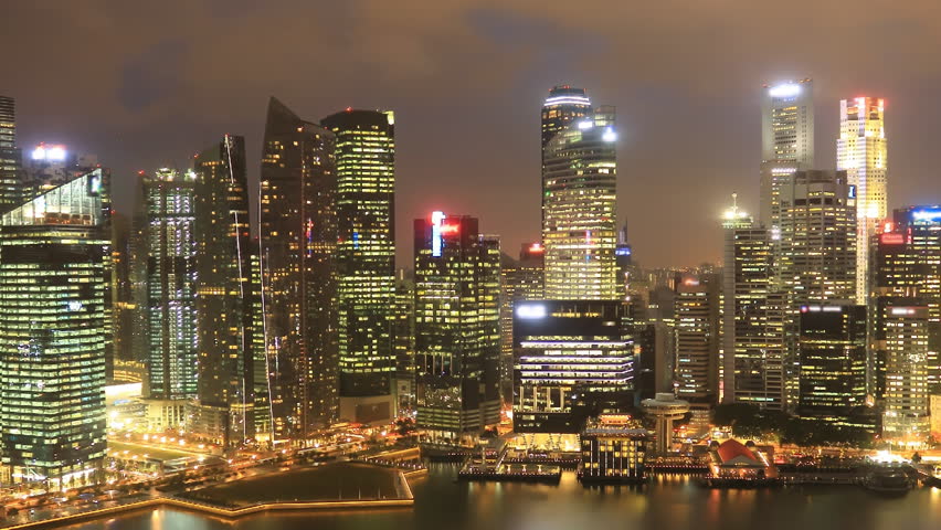 Time Lapse Singapore Skyline at Night.  View to Financial / Business District, Singapore River, Clarke Quay. Pan movement.