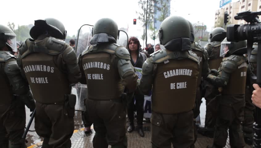 SANTIAGO, CHILE - OCTOBER 06: Chilean riot disperse protesters during a student strike on October 6, 2011 in Santiago, Chile. Protesters demand the government to improve education quality
