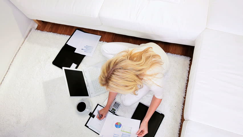 Freelance female business consultant working against deadline from home