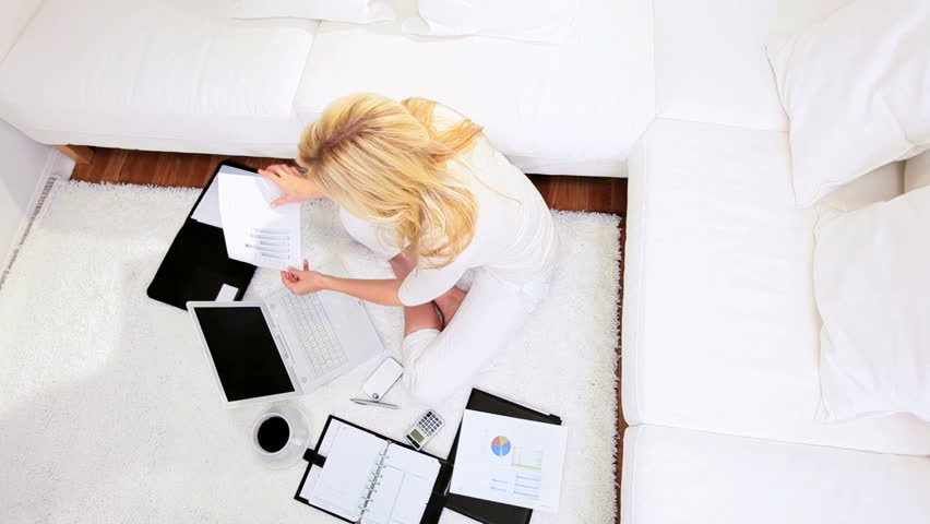 Blonde freelance business advisor working home against the clock contract deadline