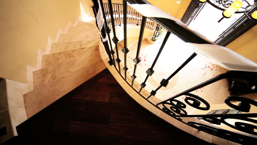 Young african american bride in full wedding dress veil running out elegant entrance hall luxury house